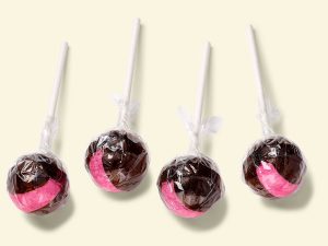 Küfa Cherry Cola Lolly, ball-shaped (cola-brown/pink) with cherry cola taste