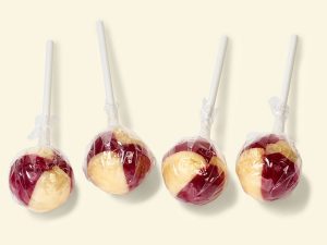 Küfa KiBa-Lolly ball-shaped lollipop with cherry-banana flavor, red/yellow